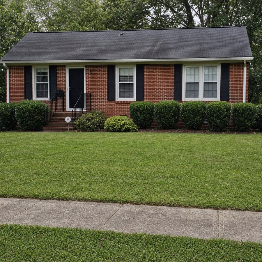 Finished lawn maintenance service with a clean yard and tidy curb appeal